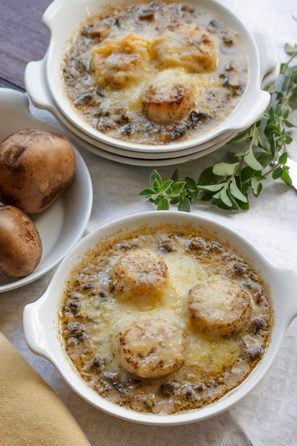 Coquilles Saint Jacques served in broil proof round dishes.