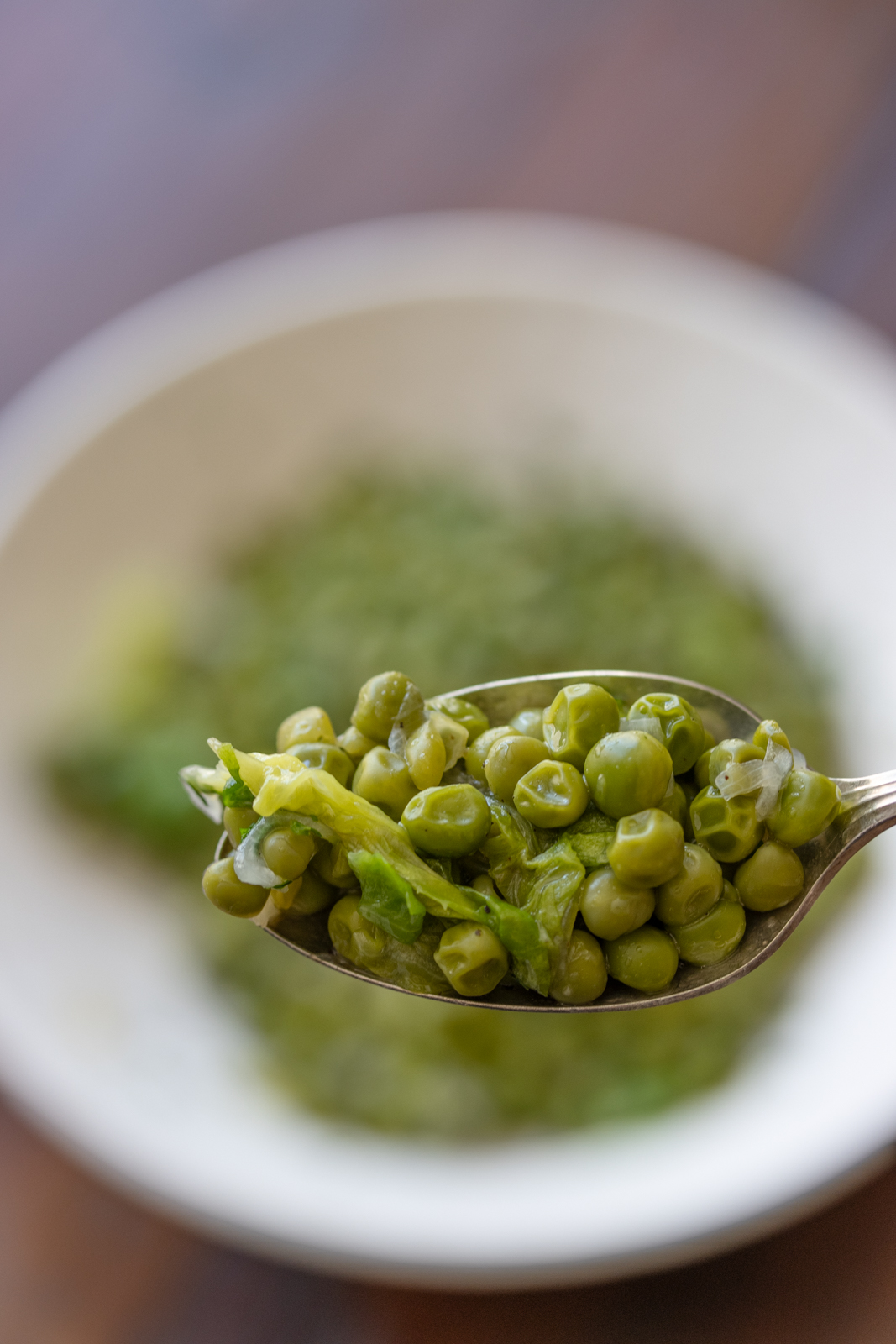 French peas on a spoon close up
