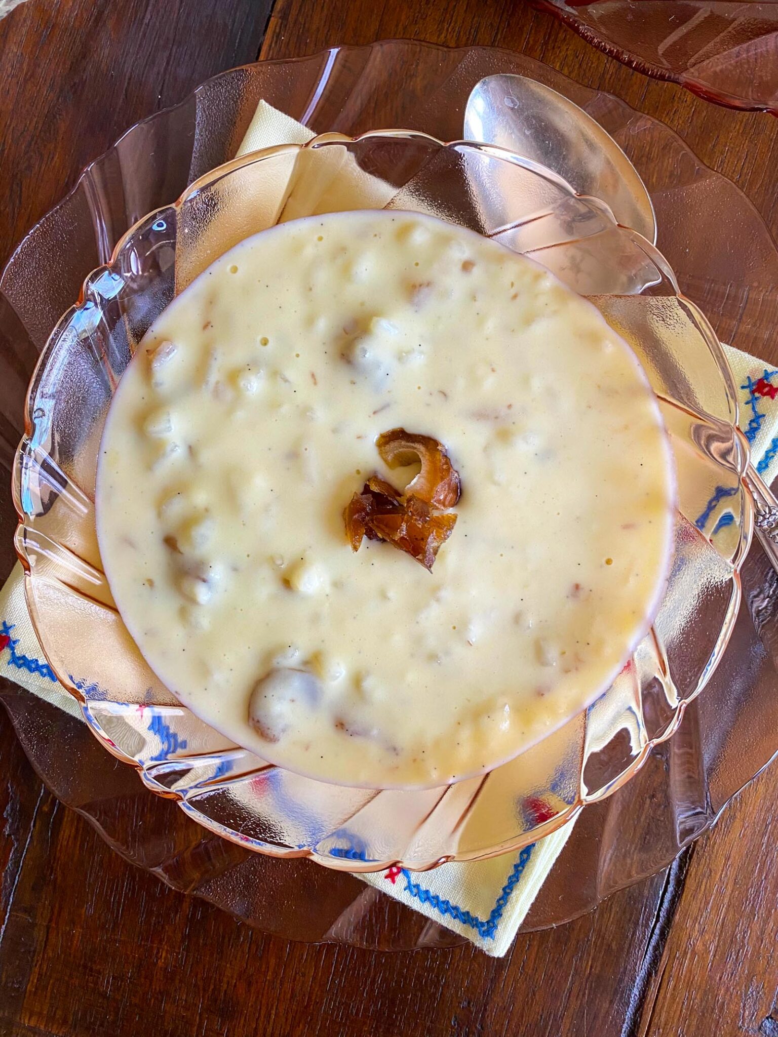 rice pudding with dates on a serving glass dish