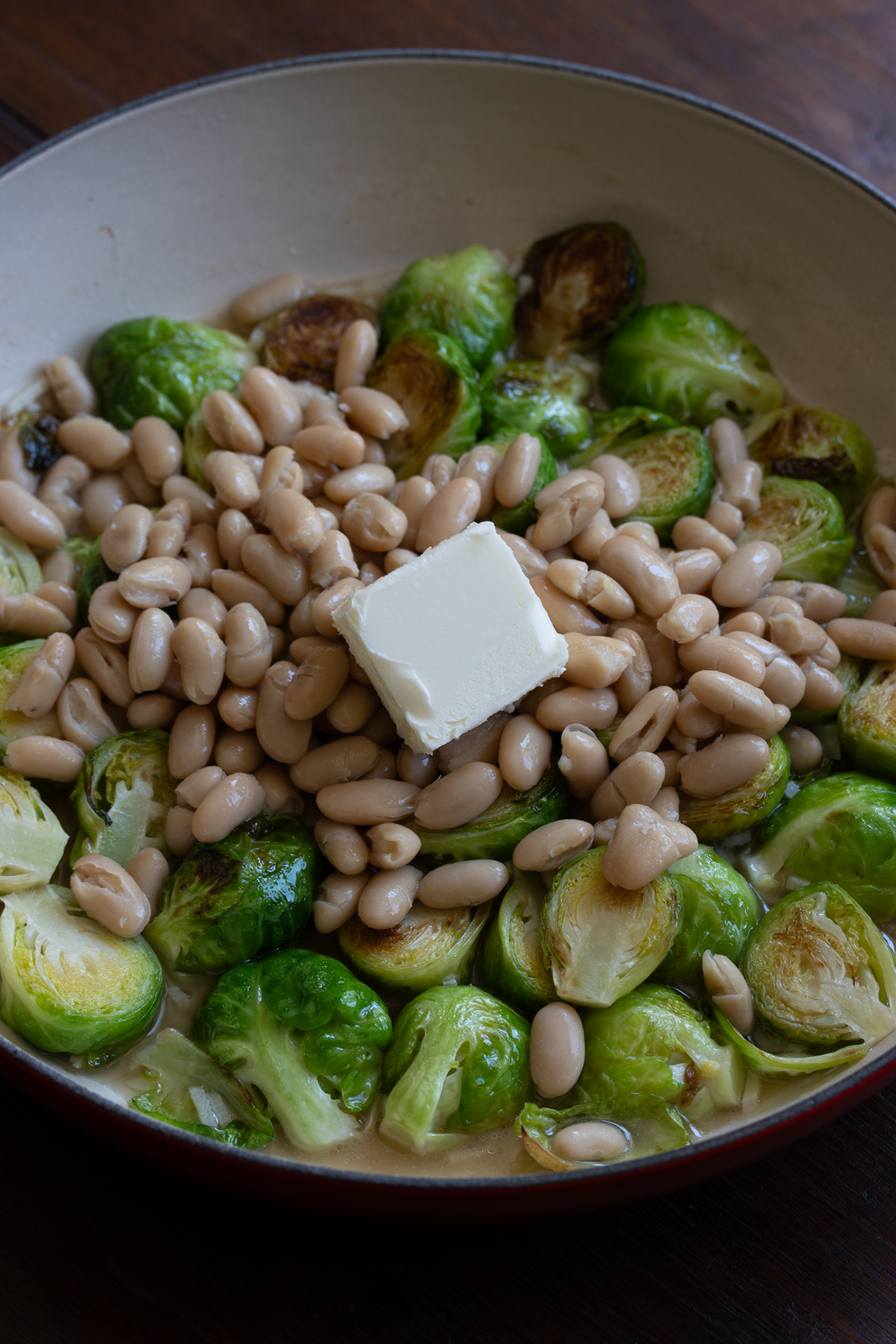add butter to brussels sprouts and white beans