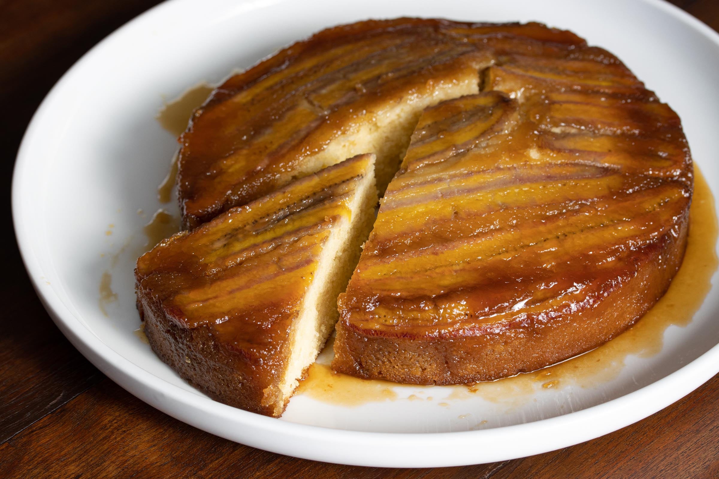 banana upside down cake on a white cake