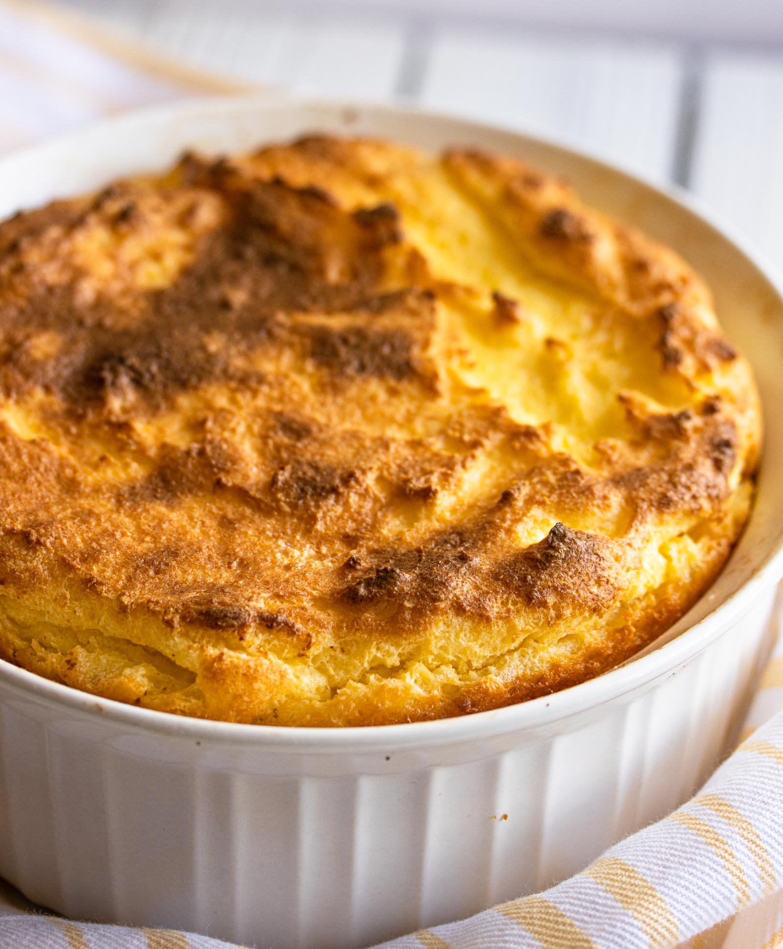cornmeal spoon bread in a white souffle dish