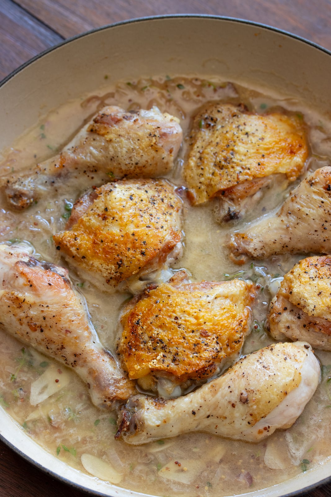 Chicken returned to the pan and ready to be placed into the hot oven.