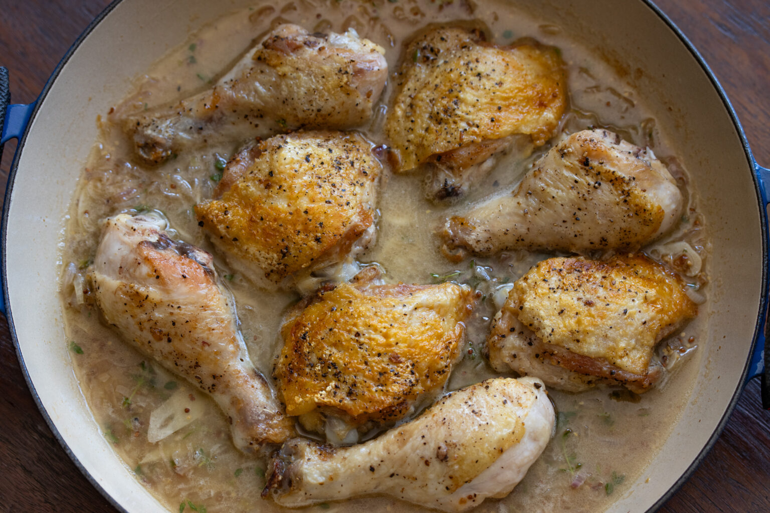 wine and chicken drumsticks and thighs ready to go in the oven