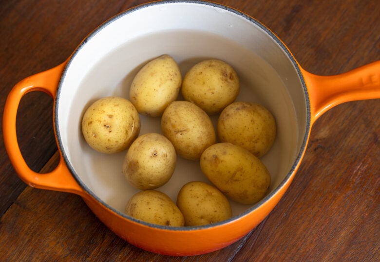 potatoes in pan filled with water