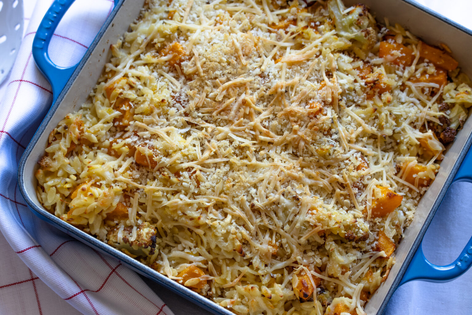 gratin baked with golden crust on a cast iron ovenproof dish