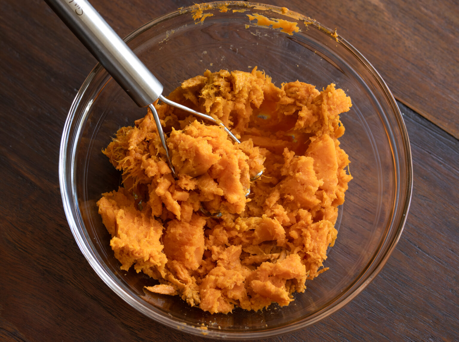 Smashed sweet potato in a bowl.