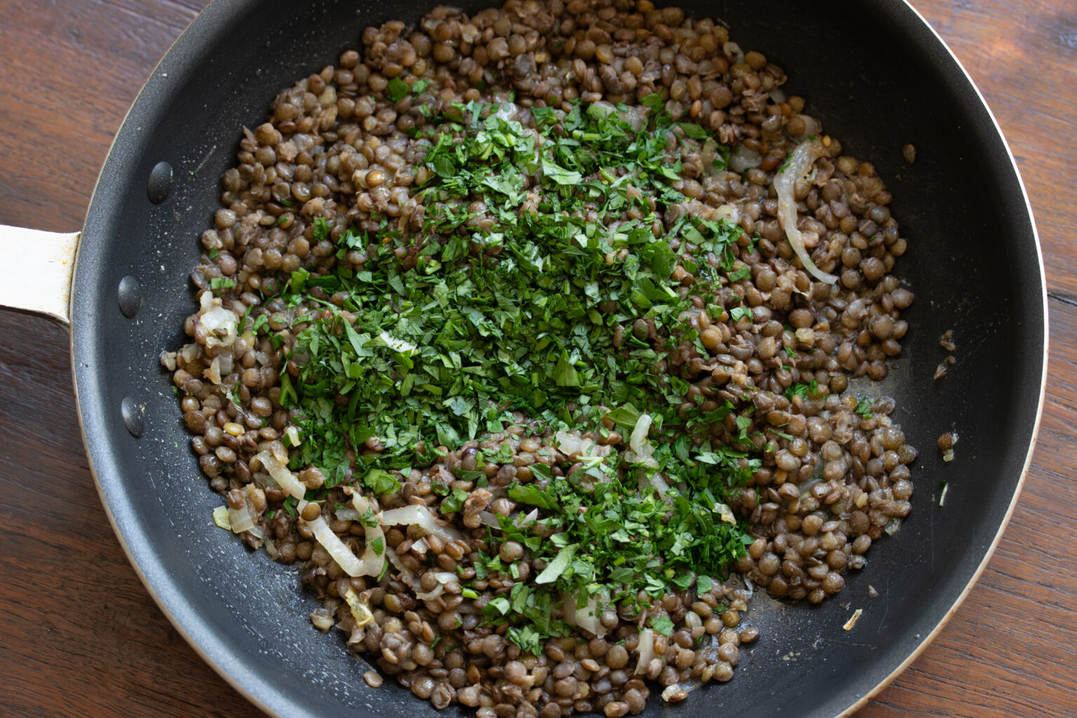 shallots and lentils in a skillet