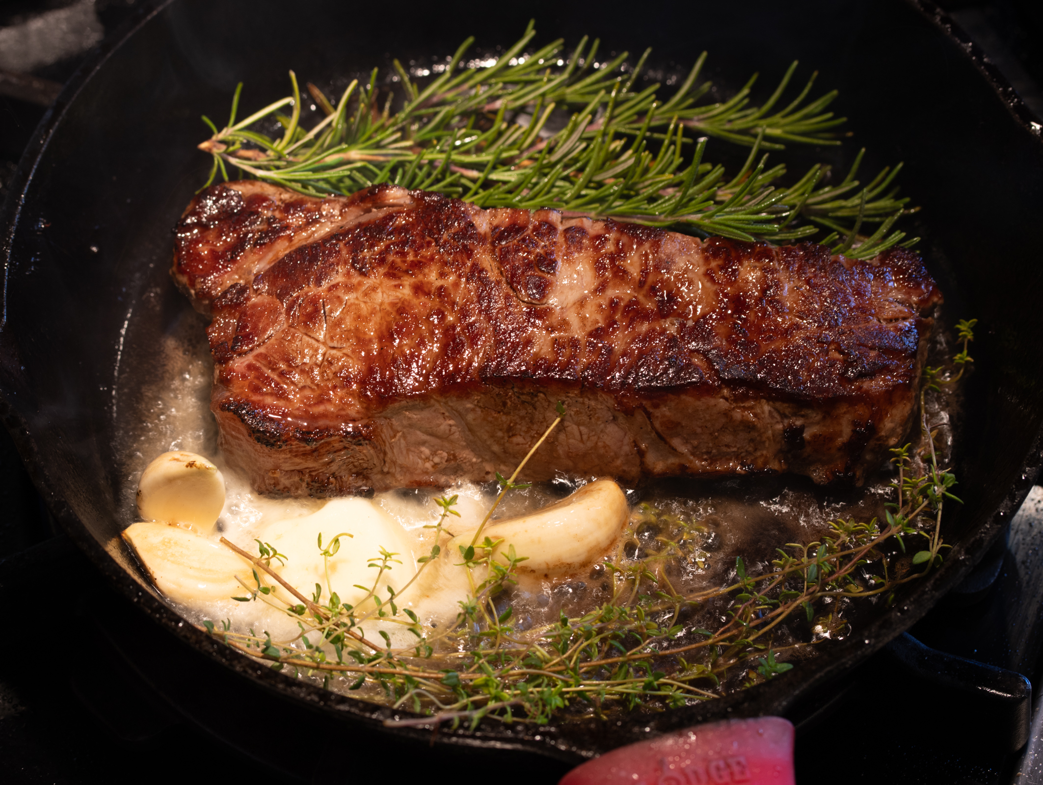 herbs, garlic and butter added to the skillet