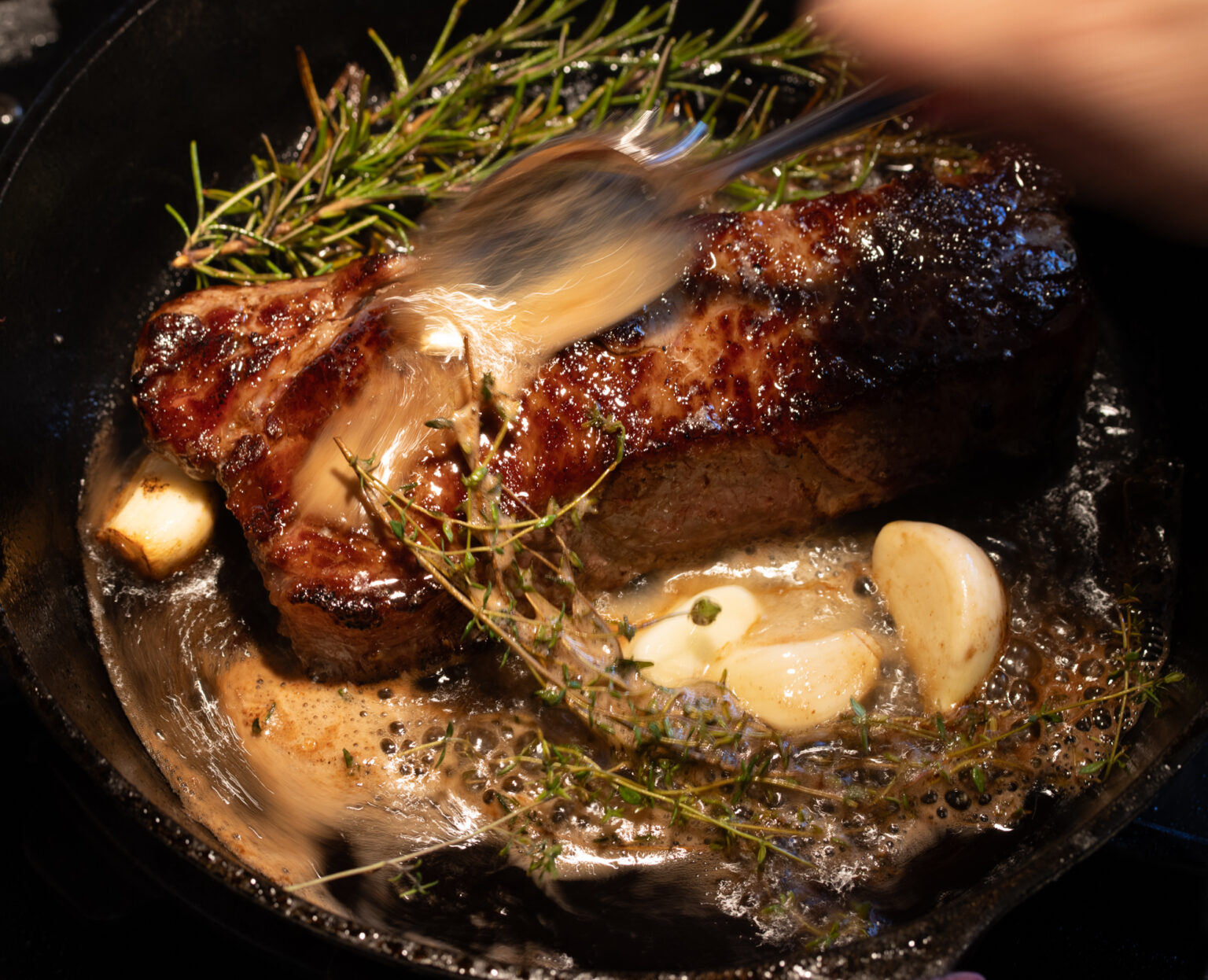 basting the steak