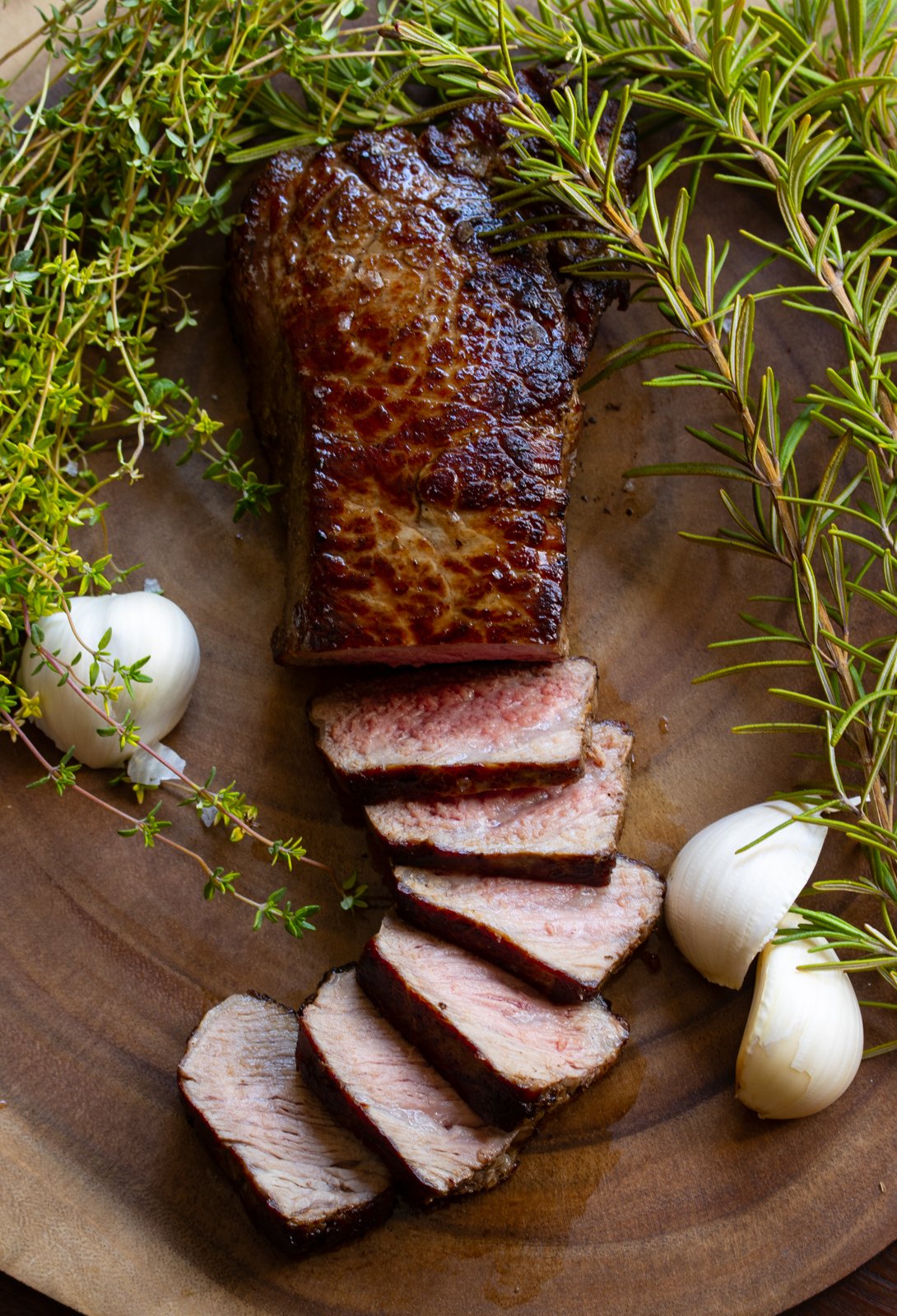 sliced on a wooden board pan seared steak