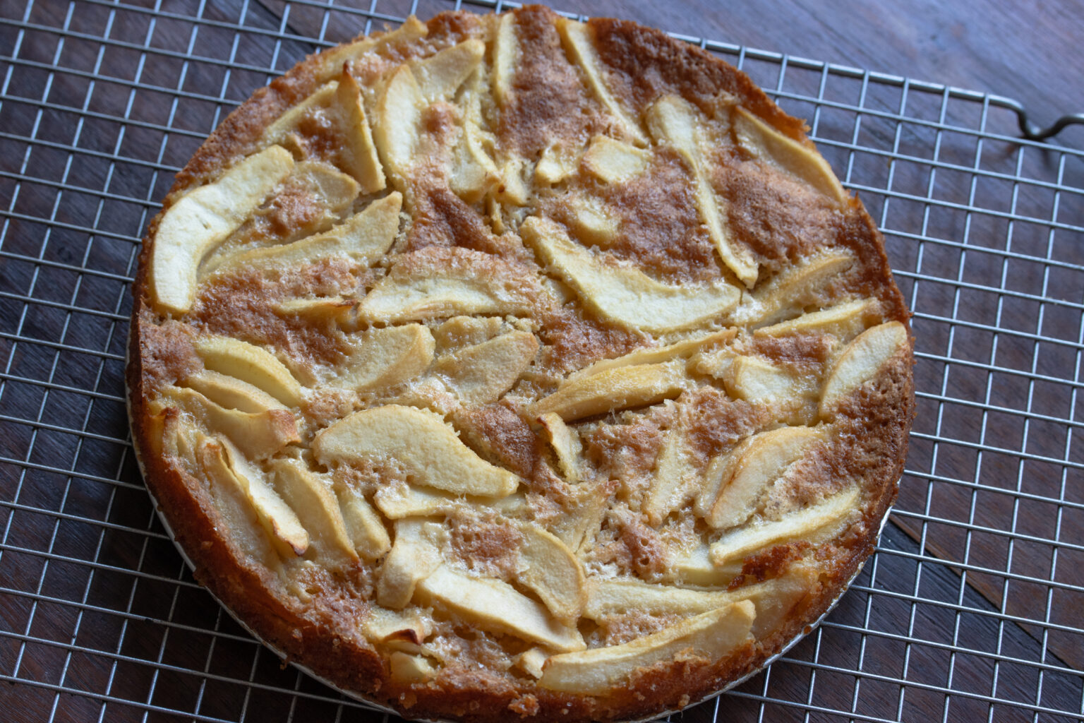 Springform removed and cake placed on a cooling rack