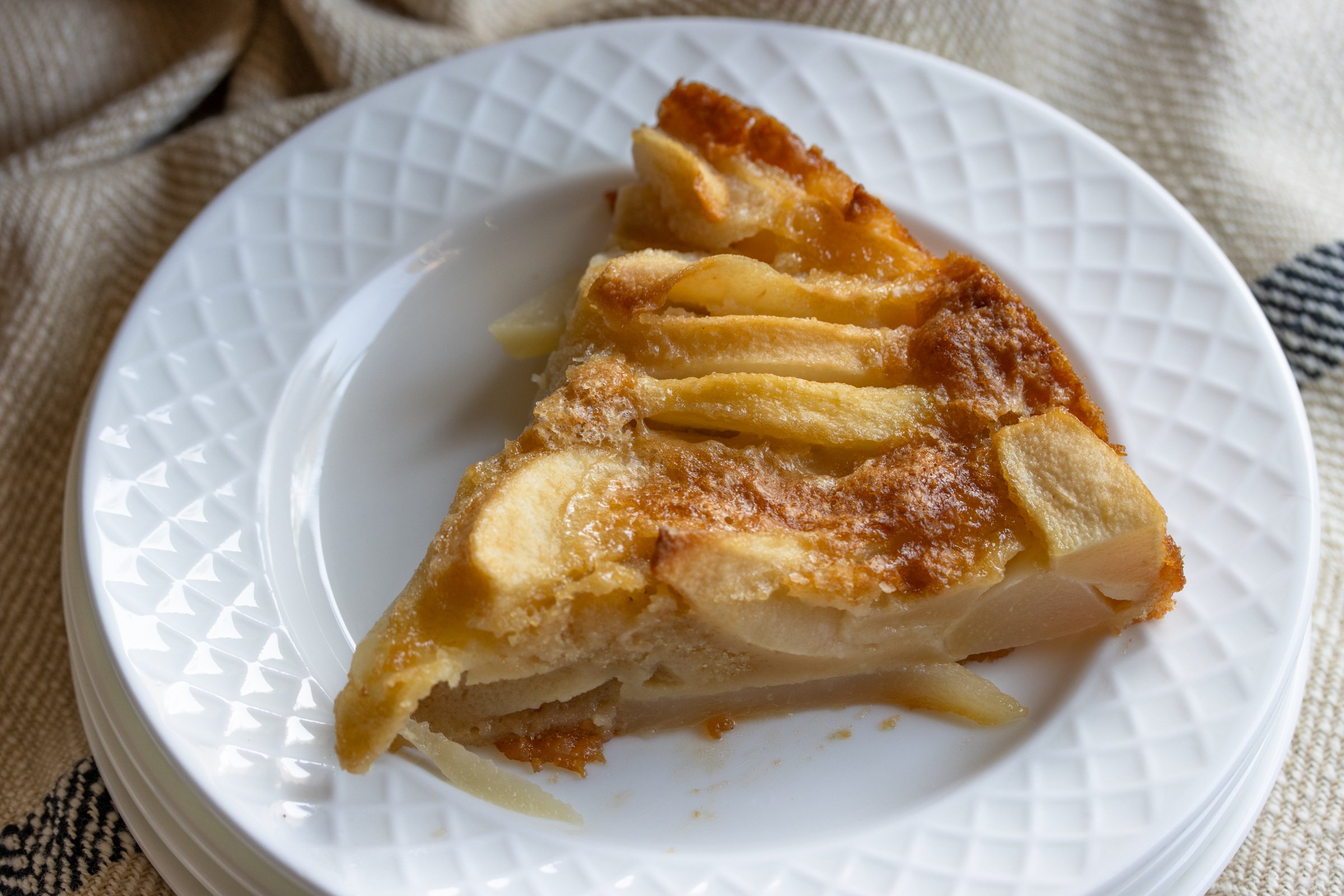 slice of pear cake on a white plate
