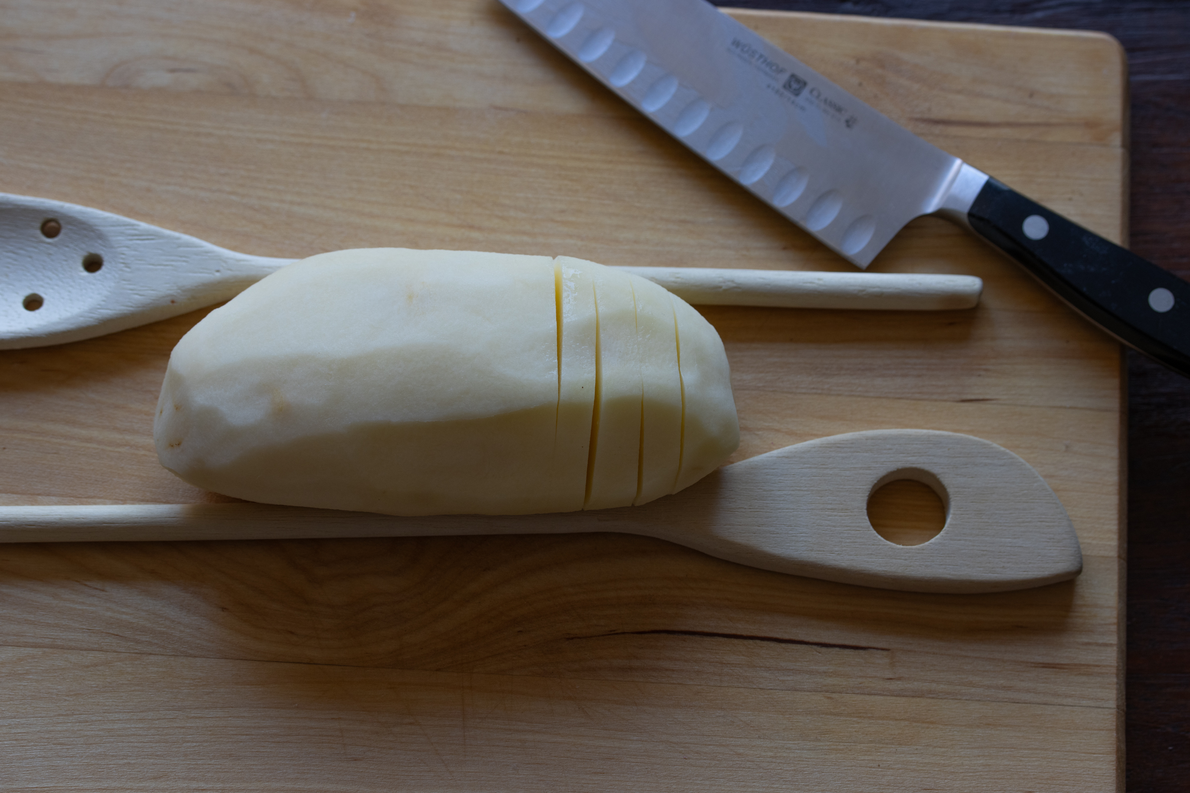 sliced poptates on a cutting board