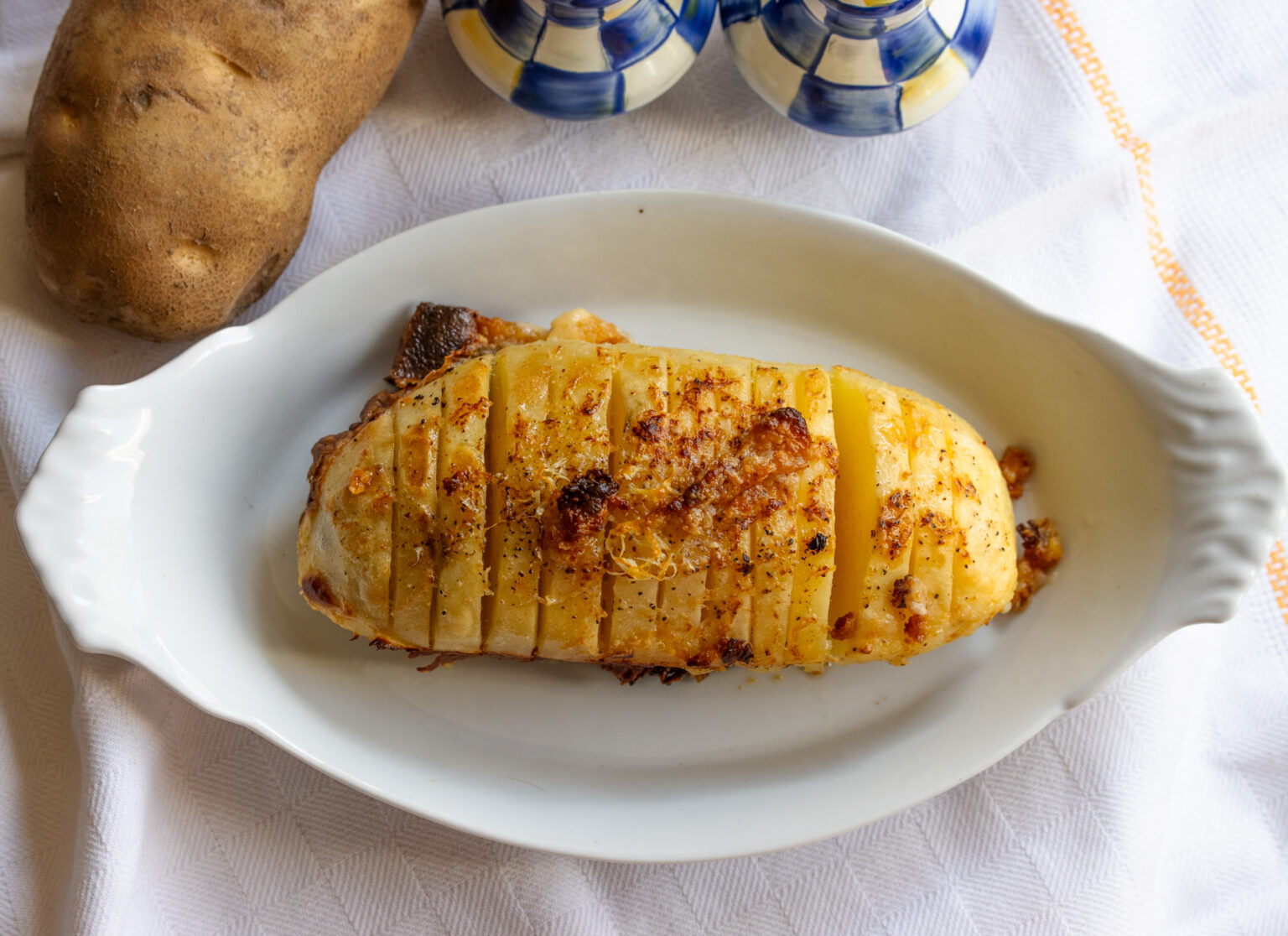 Potatoes Cooked In Milk  on a white serving grating dish