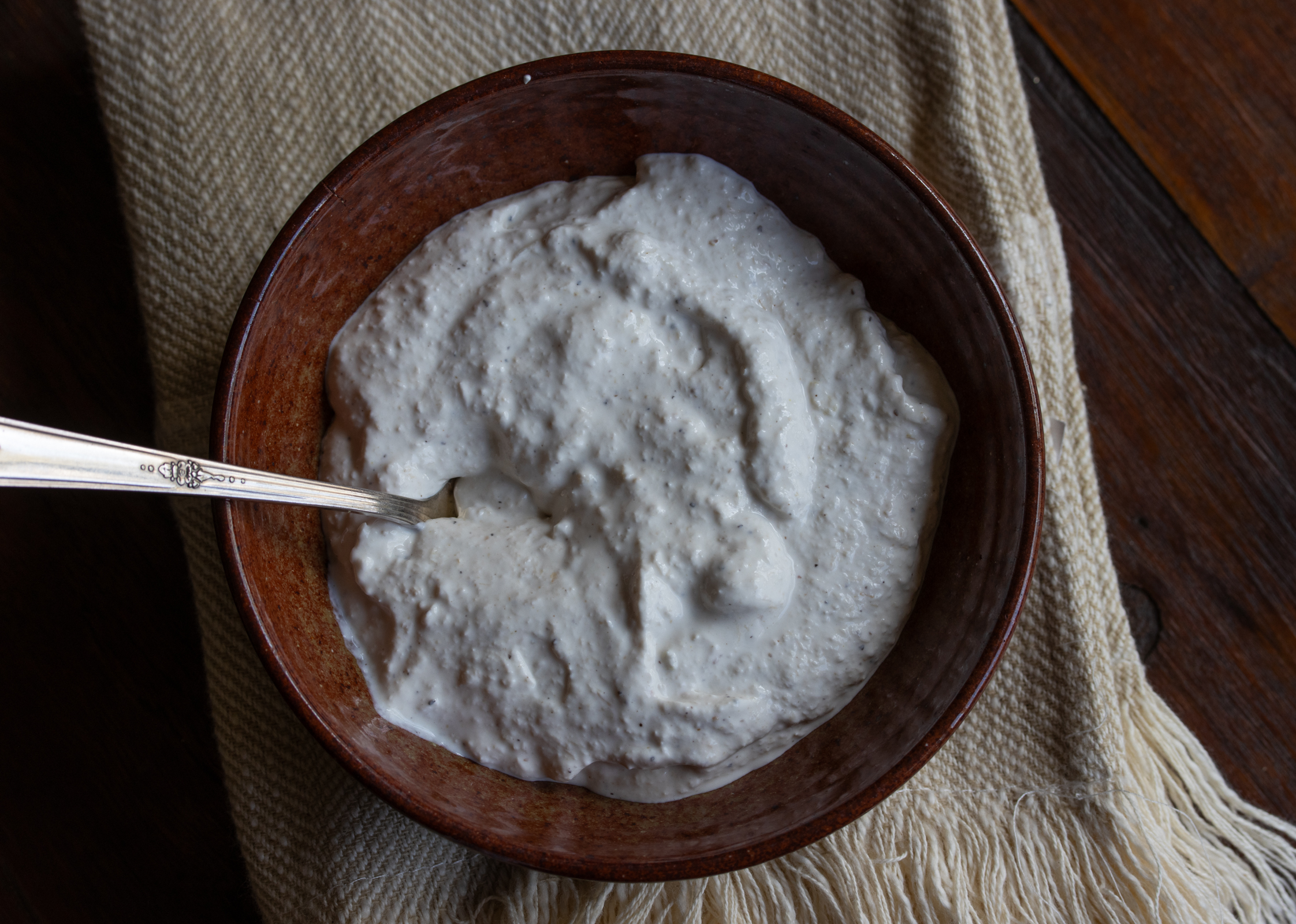Horseradish Sauce in a dark brown serving bowl