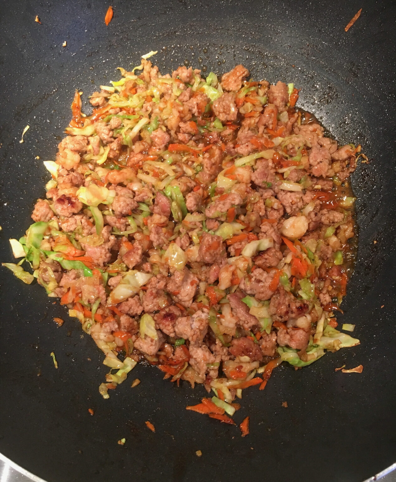 egg rolls ingredients in the wok cooking
