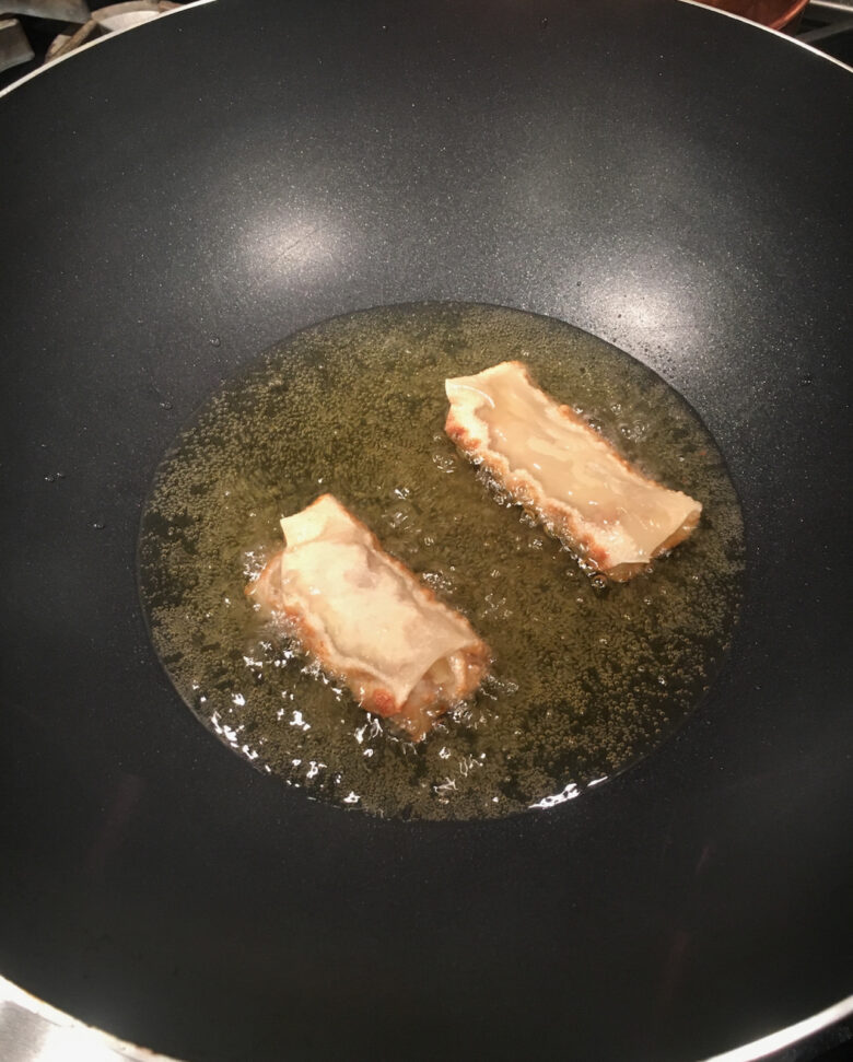 frying hte egg rolls