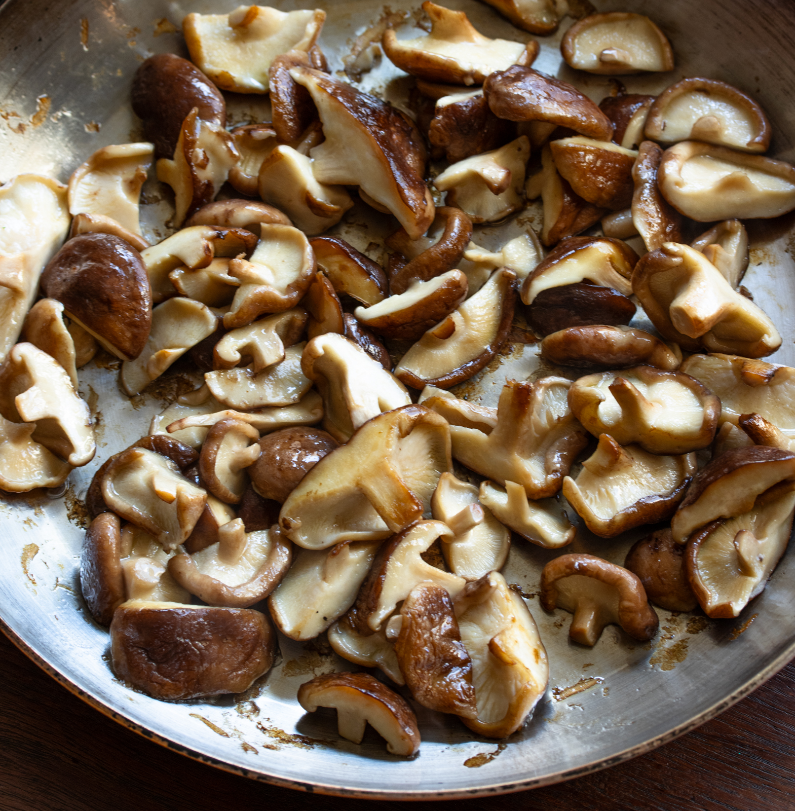 mushrooms sauteeing in a skillet