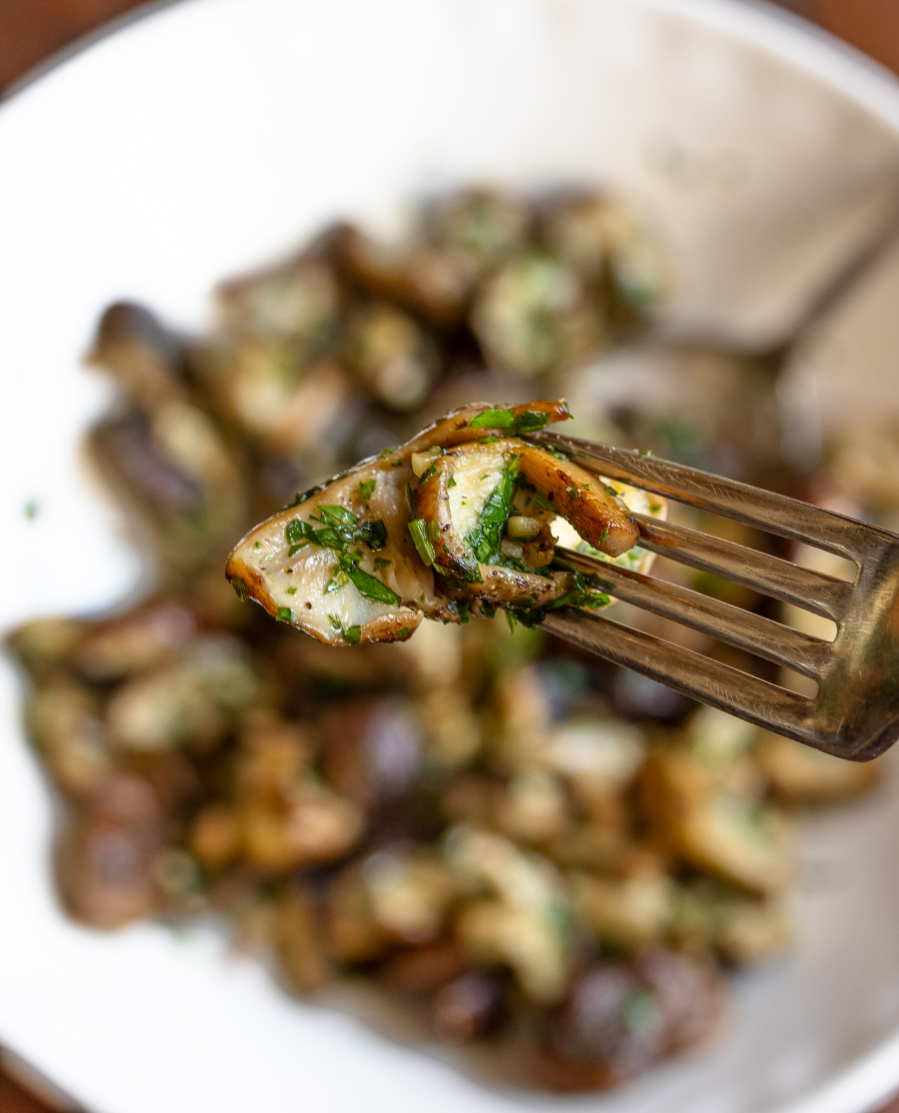 garlic mushrooms on a spoon