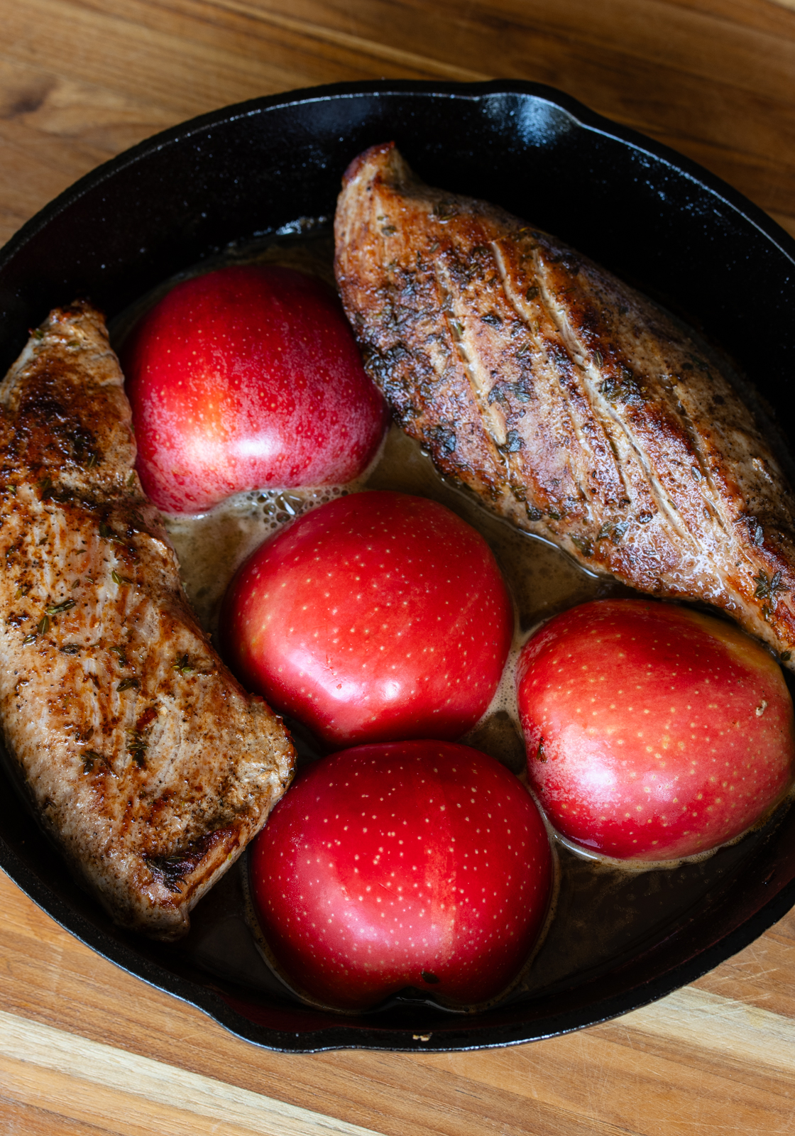 Apples added to the skillet with the tenderloin.
