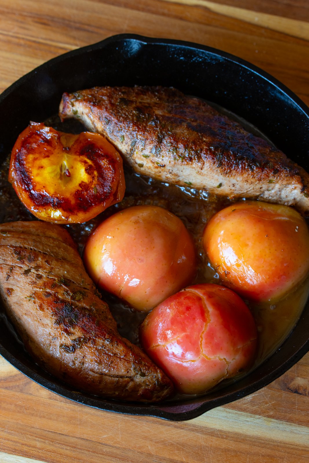 Cooked apples with the pork tenderloin in the skillet.
