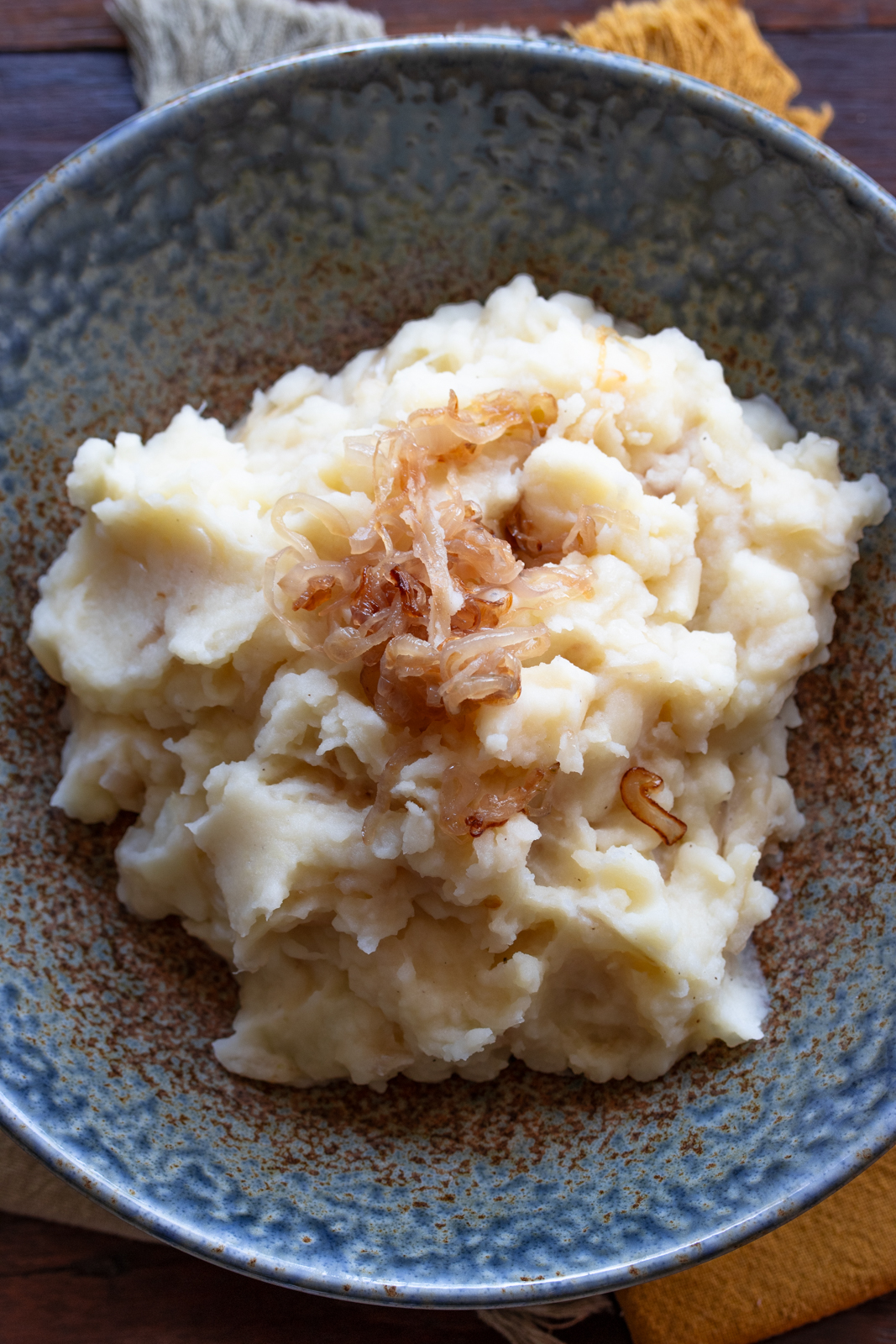 Buttermilk mashed potatoes in a blue serving bowl