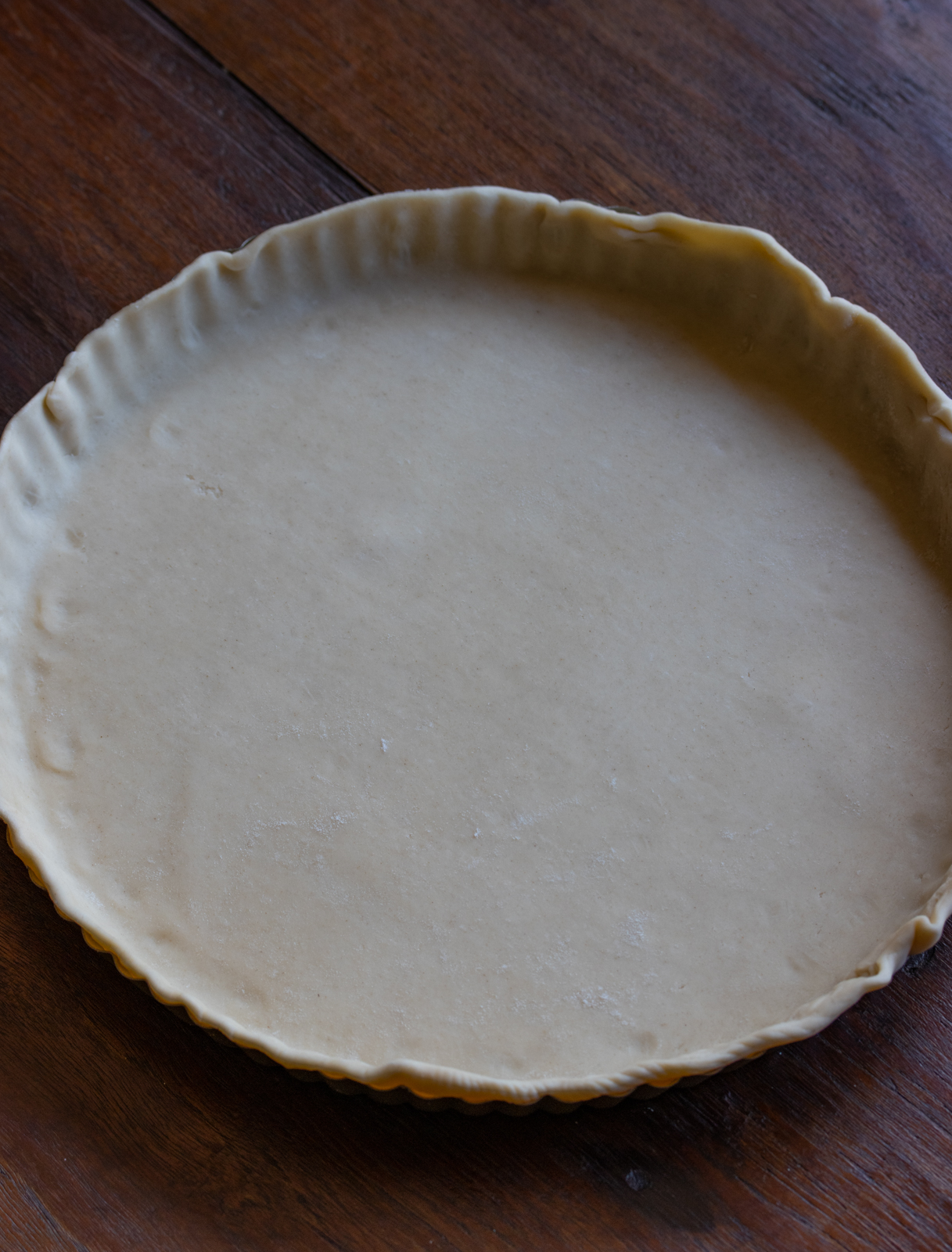 pie dough rolled out to pre-bake