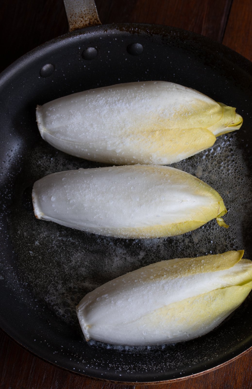 salt and sugar over endives