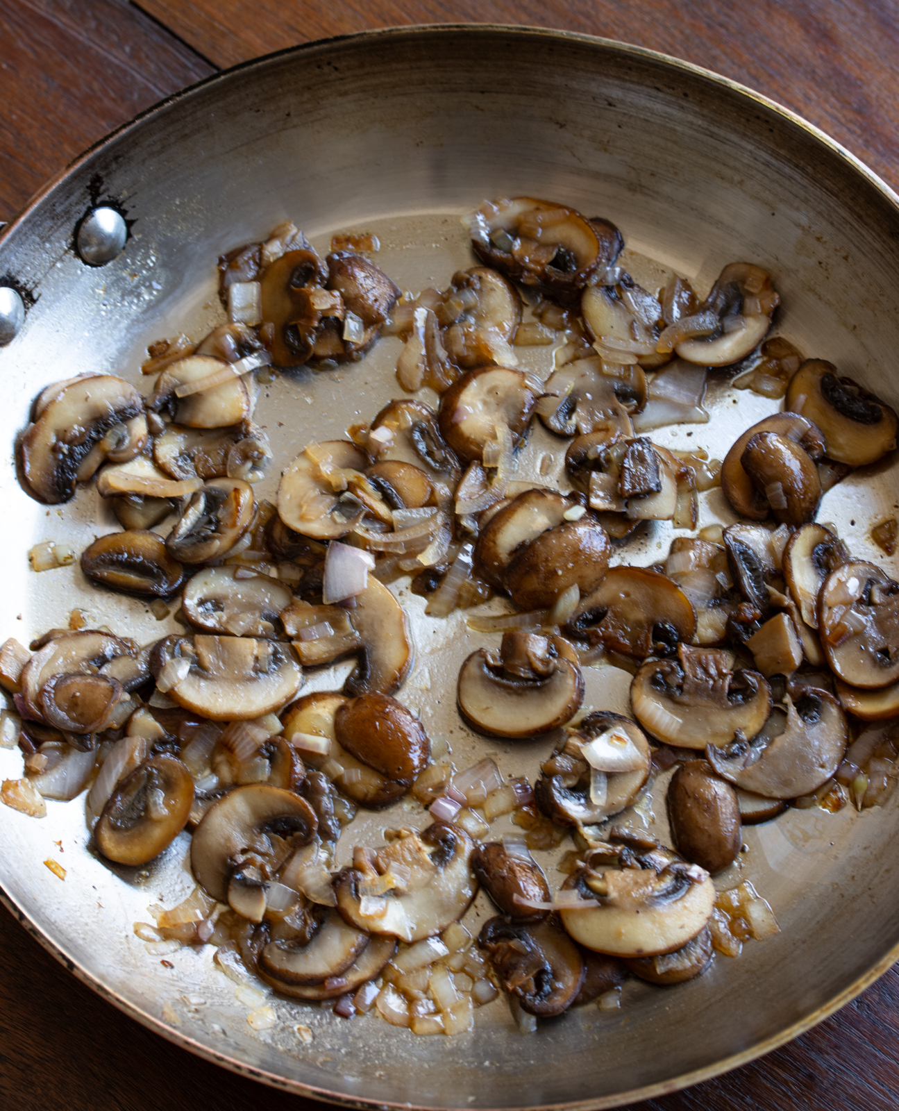 sauteed mushrooms and shallots ready to have the farlfalle pasta added