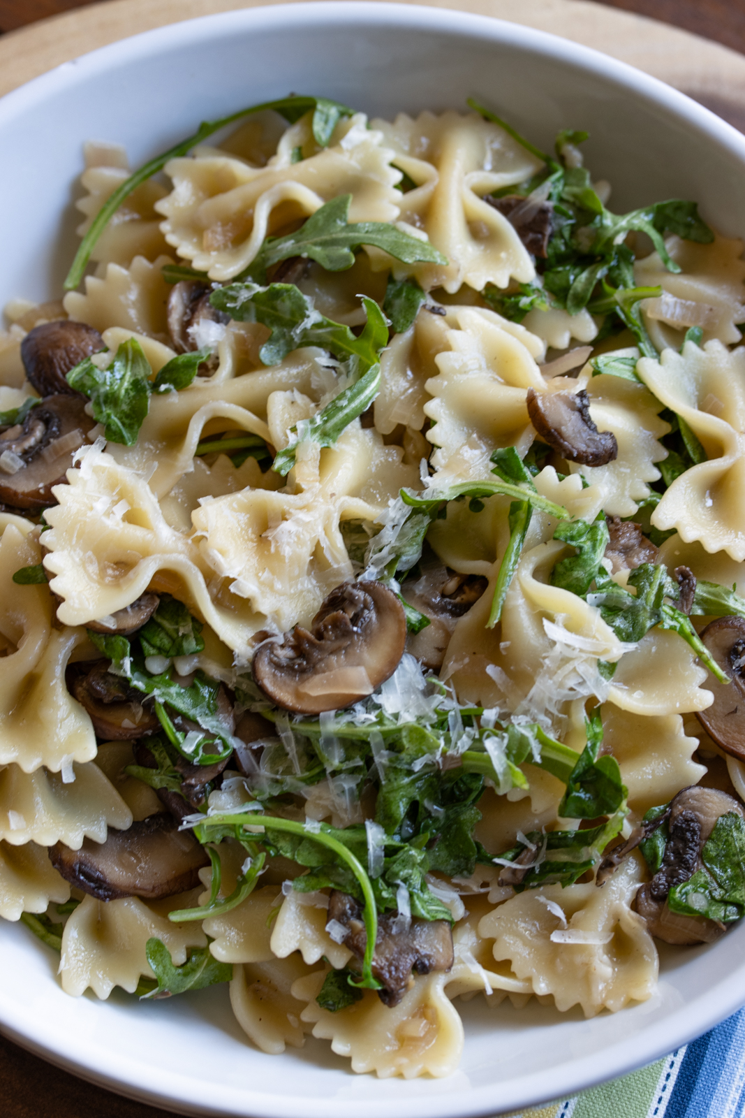 creamy mushroom pasta in a white serving bowl