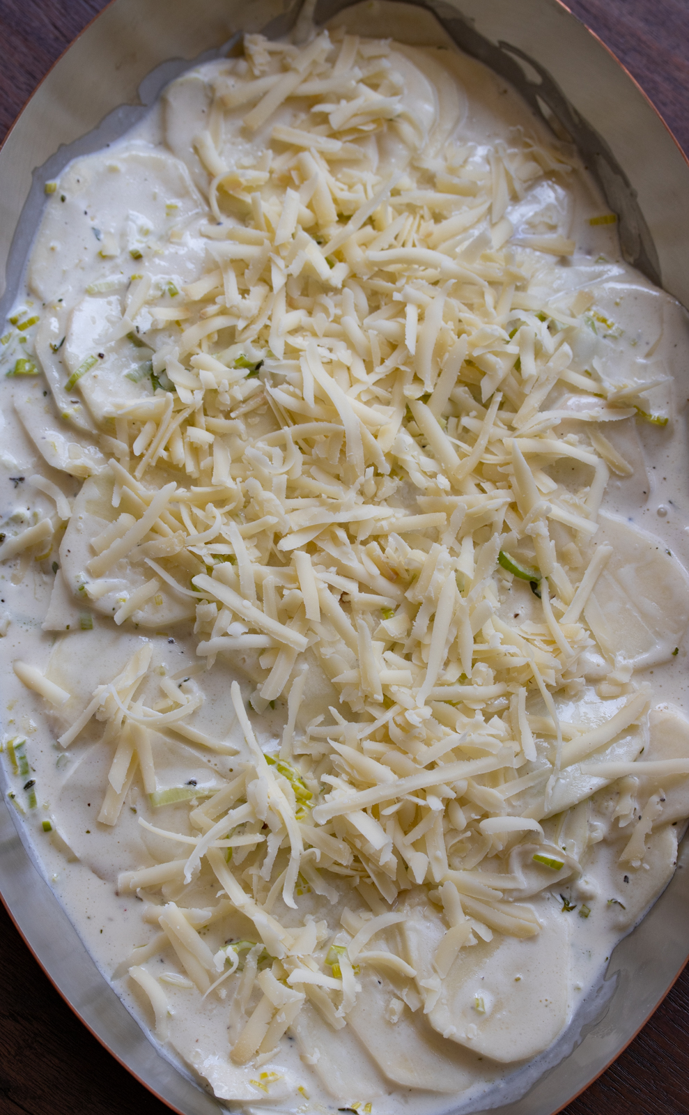 cheese added to the leek and potato gratin