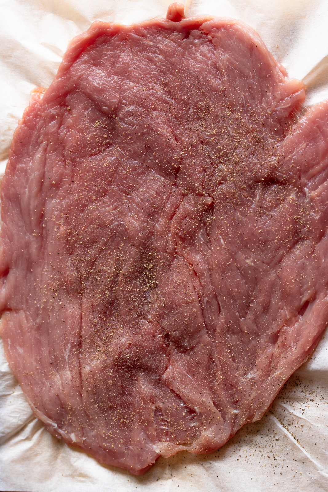 generously seasoned tenderloin with salt and pepper