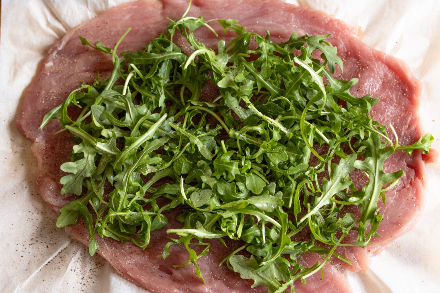 arugula over the pork tenderloin