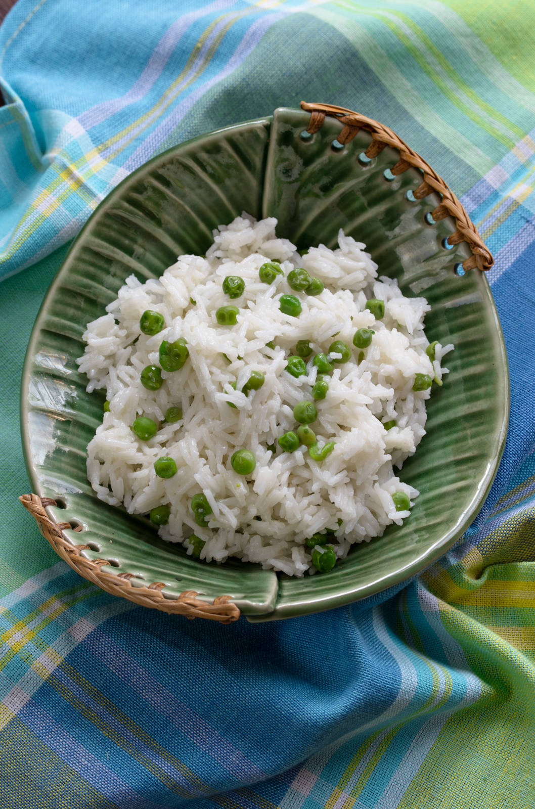 butter rice in a green serving dish