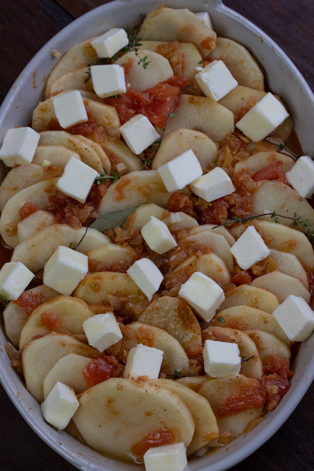 butter over the gratin dish