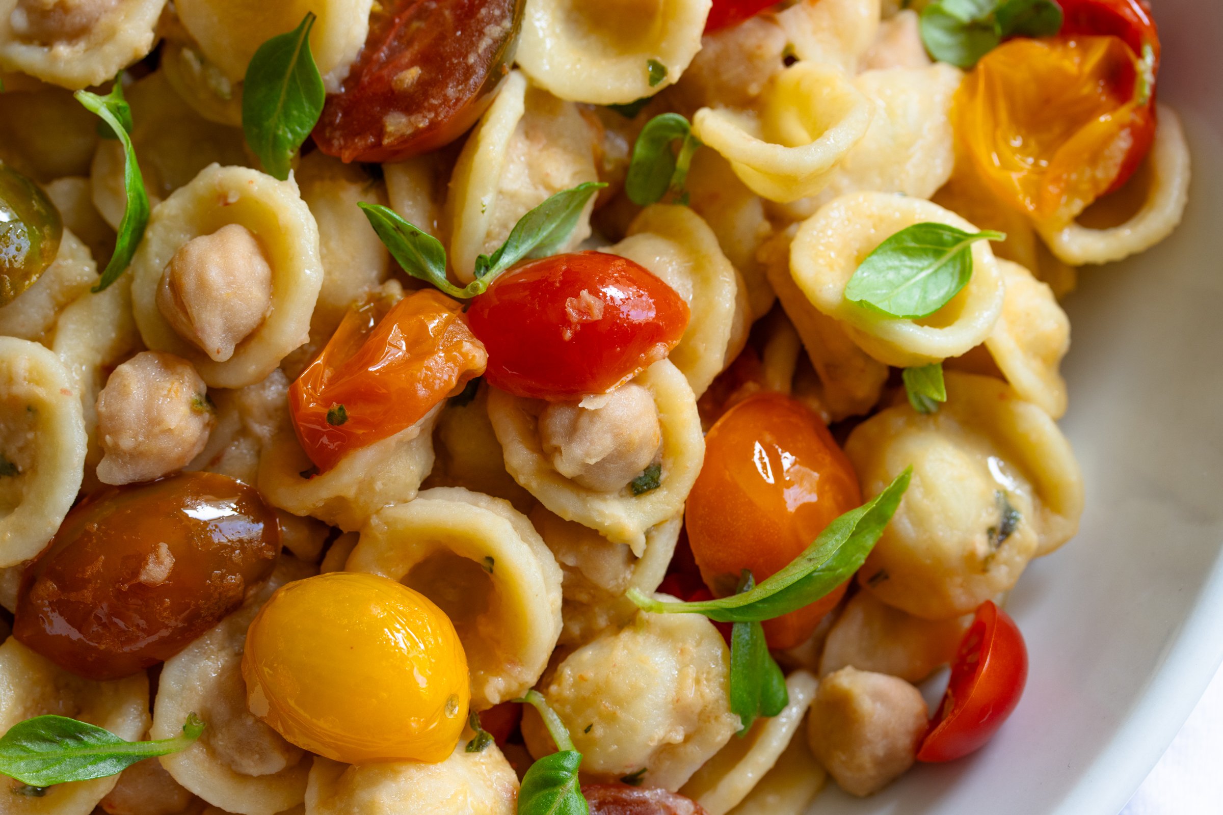 close up for orecchiette pasta, chickpeas, and cherry tomatoes