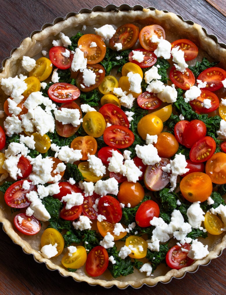 spinach feta quiche ingredients int he pie mold