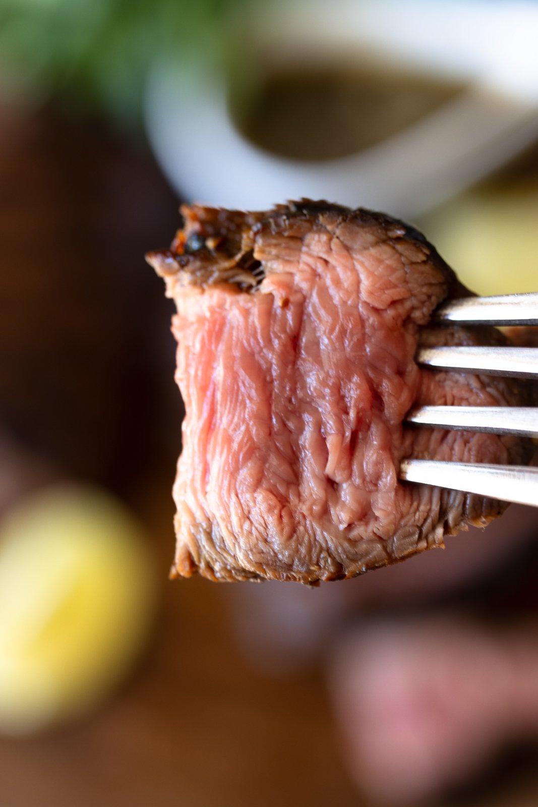 bite of steak on a fork