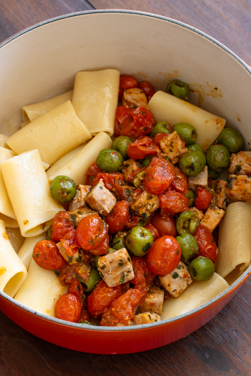 paccheri returned to the pan and tomatoes with tuna added to it