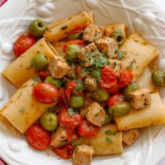 paccheri with fresh tuna in a white serving bowl