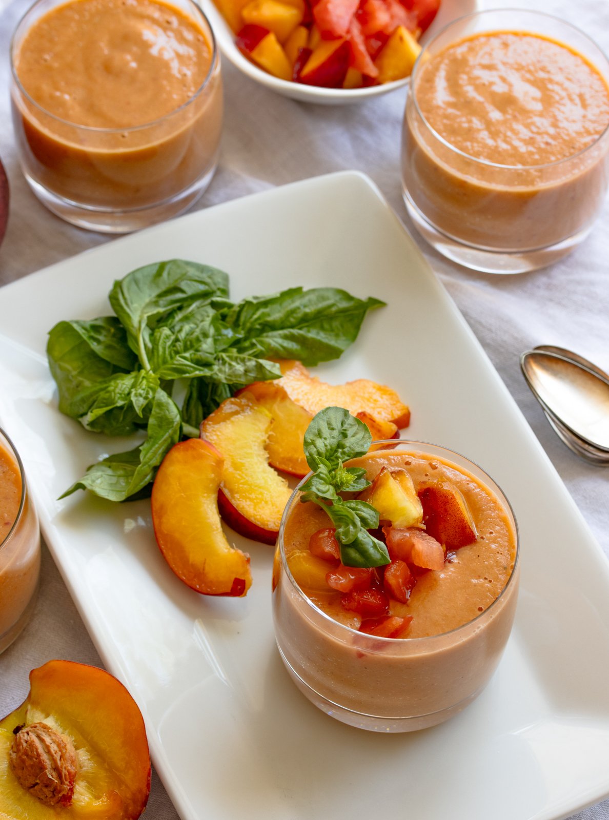 peach tomato gazpacho in serving glasses