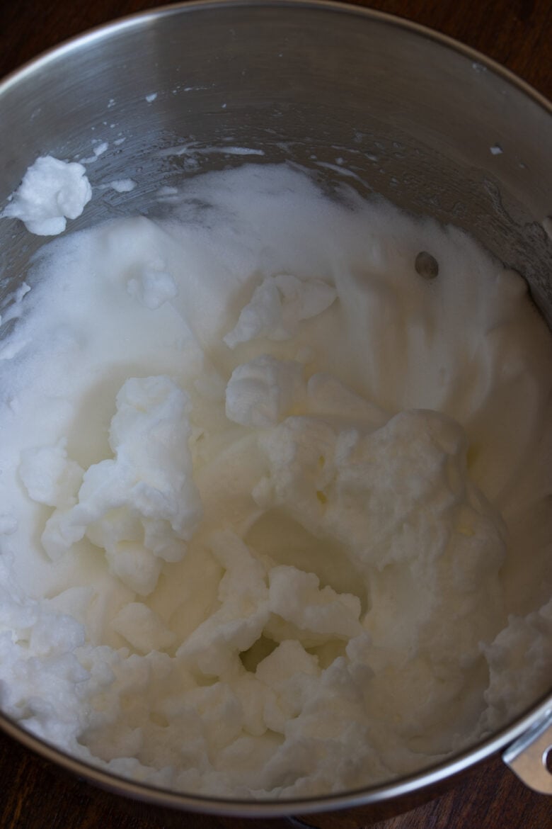 Egg whited beaten until hard tips are formed.