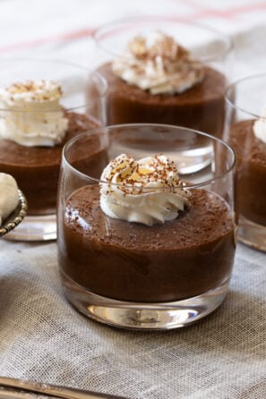 Easy chocolate mousse in a glass topped with whipped cream