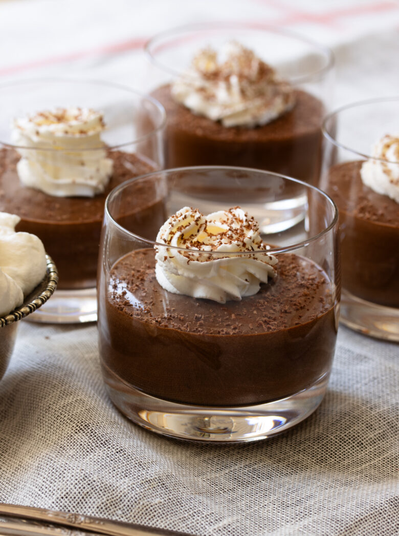 Easy chocolate mousse in a glass topped with whipped cream