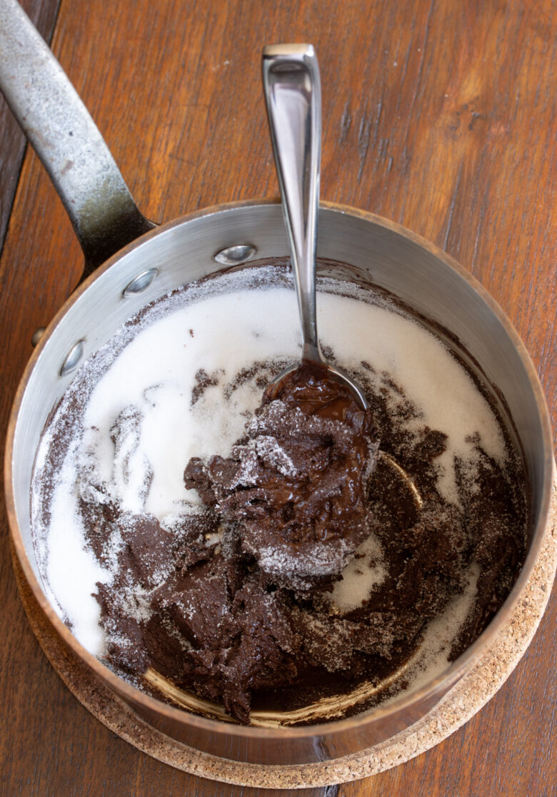 Sugar added to the melted chocolate