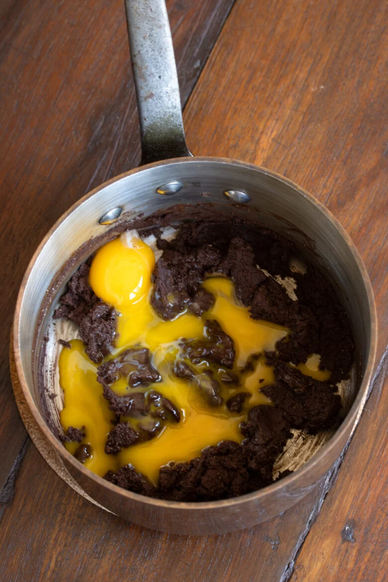 Egg yolk added to the sugar and chocolate mixture.