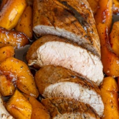 Glazed pork tenderloin sliced adn served in a serving platter.