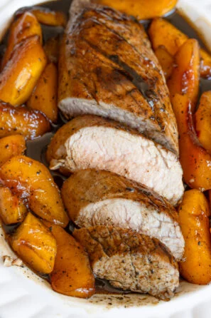 Glazed pork tenderloin sliced adn served in a serving platter.