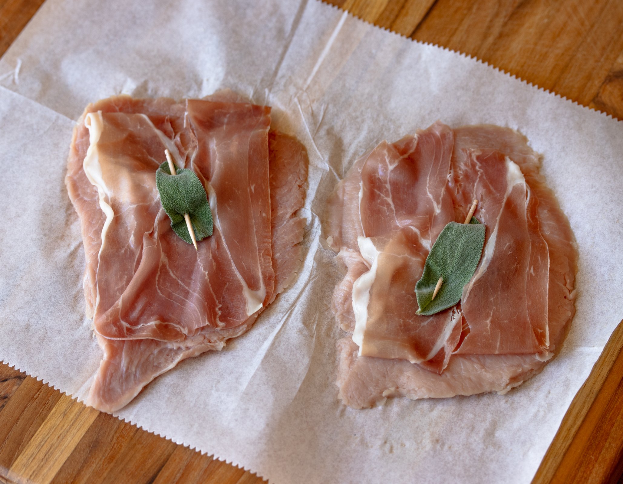 Toothpick passes thru the scallop to hold everything in place.